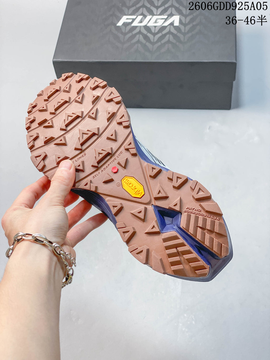 Close-up of the lugged outsole with VIBRAM branding on a KAILAS FUGA EX3 shoe