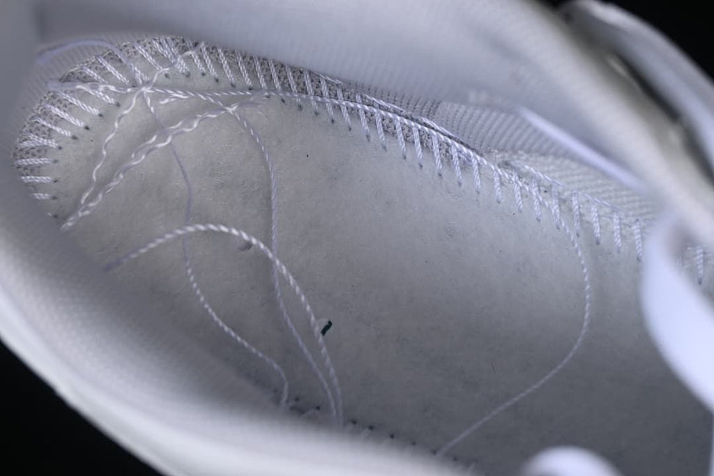 Close-up view inside the sneaker showing stitching and lining