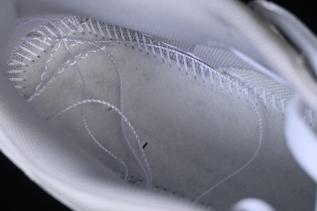 Close-up view inside the sneaker showing stitching and lining