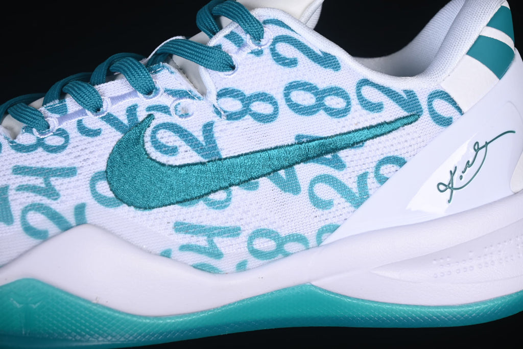 Close-up of teal swoosh, teal laces, and number-patterned upper