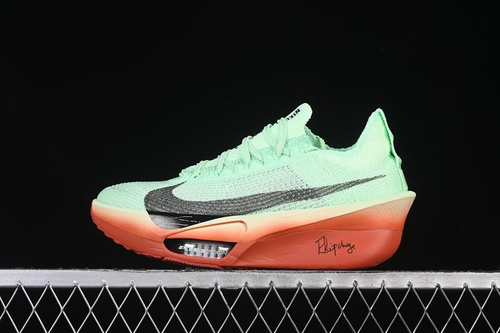 Side view of a mint-green Nike running shoe with dark Swoosh accents and a coral-orange sole.