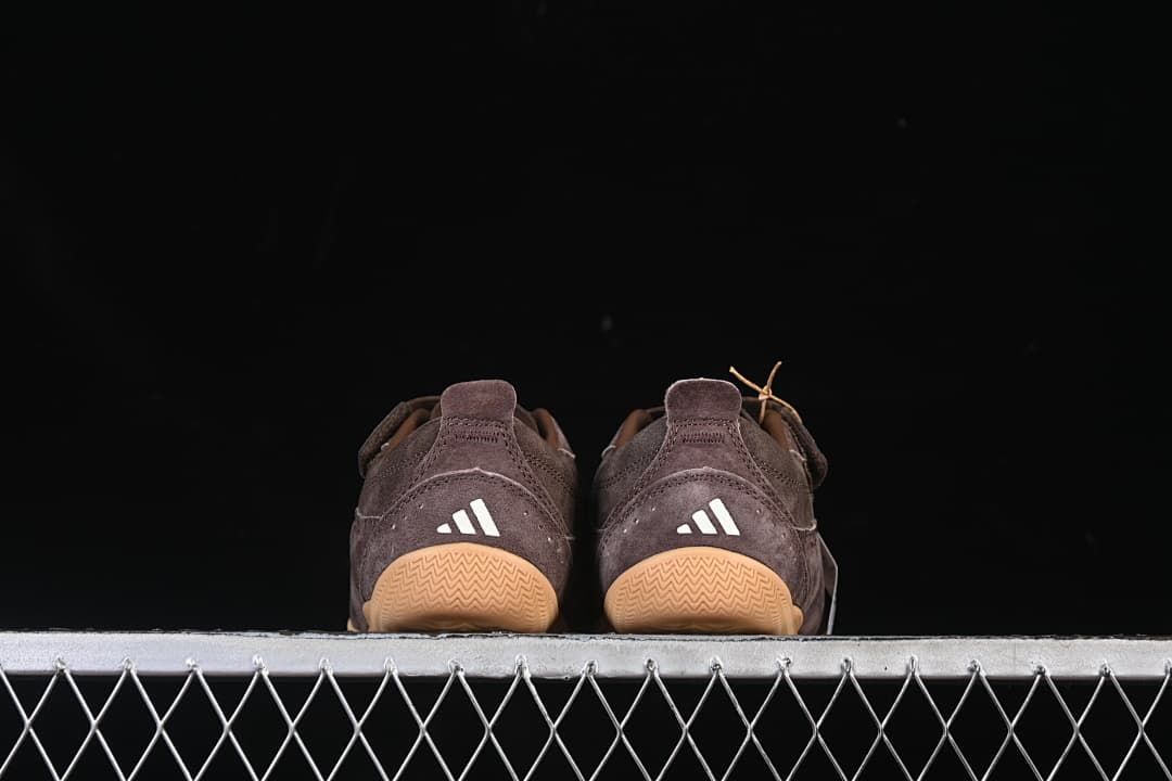 Rear view of both sneakers with gum-colored outsoles.