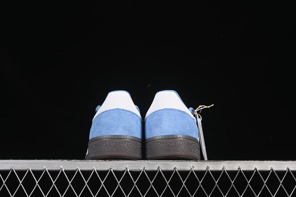 Rear view of the pair showing white heel tabs and blue uppers