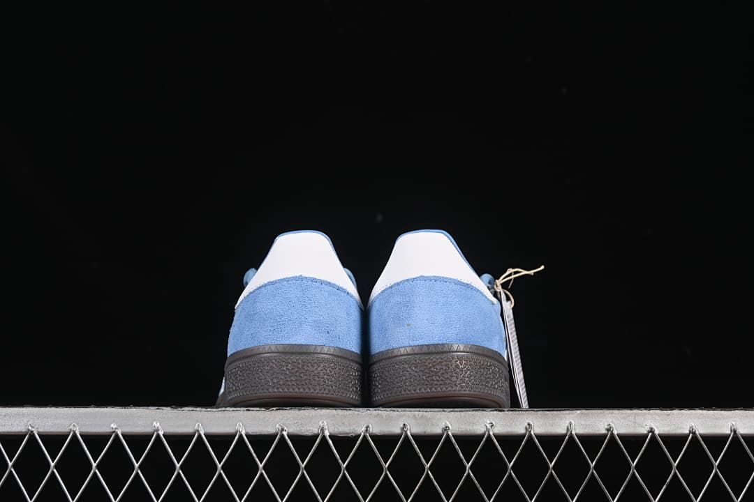 Rear view of the pair showing white heel tabs and blue uppers