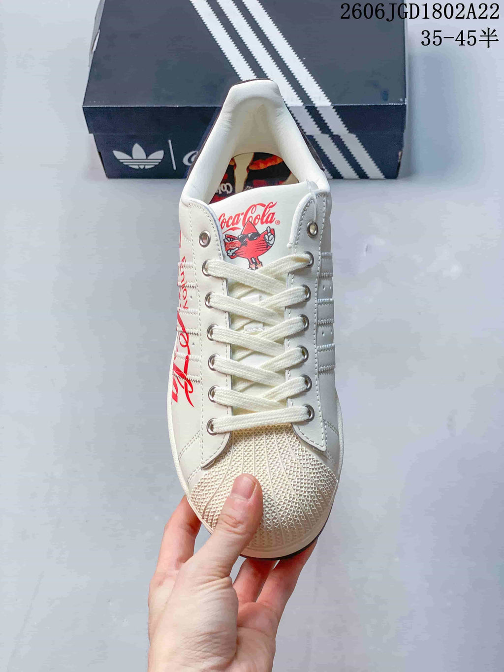 Front view highlighting the shell toe, laces, and tongue graphic.