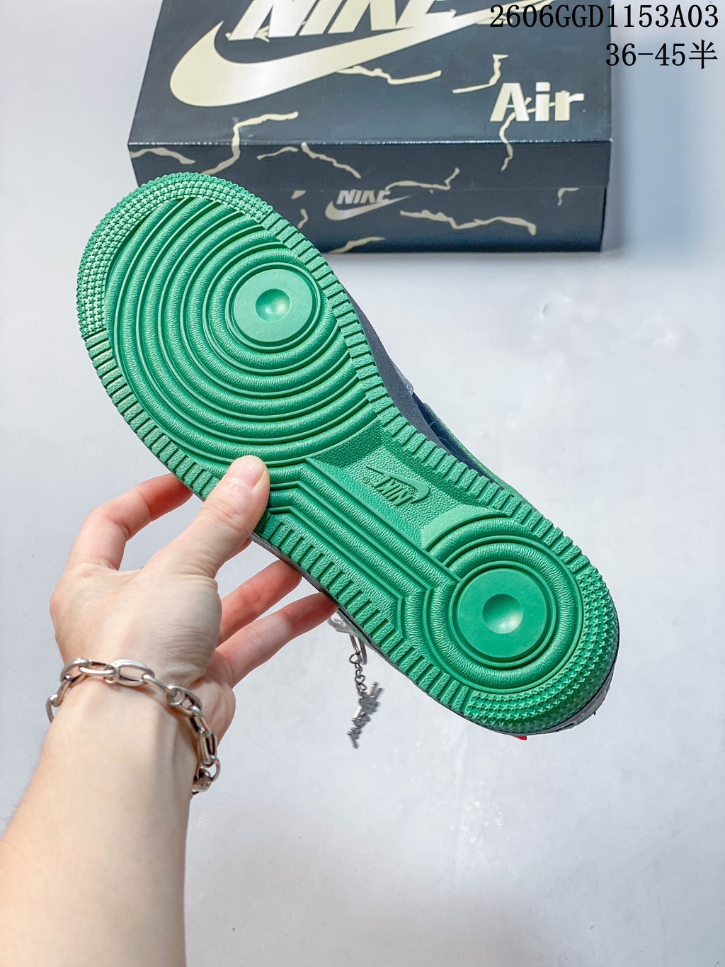 Close-up of the green outsole on the Nike Air Force 1 sneakers