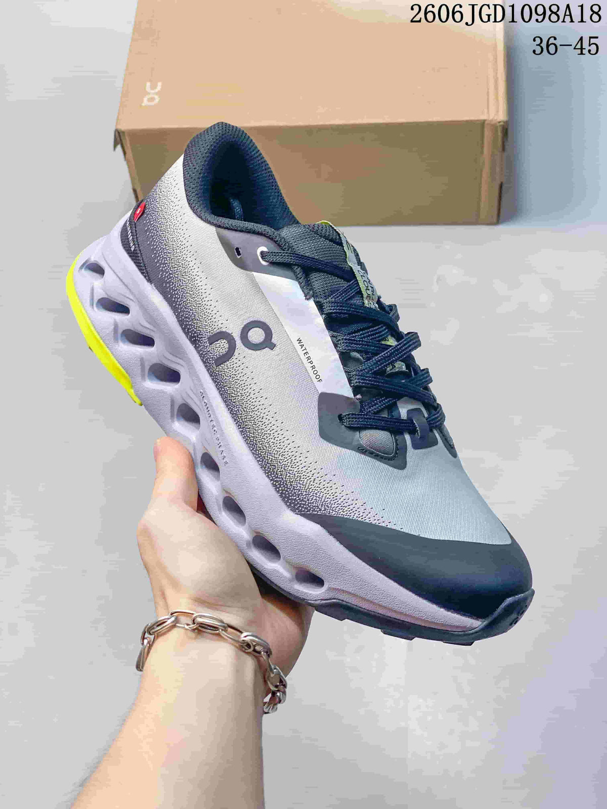 Angled side view of the shoe showing the upper, laces and sculpted outsole