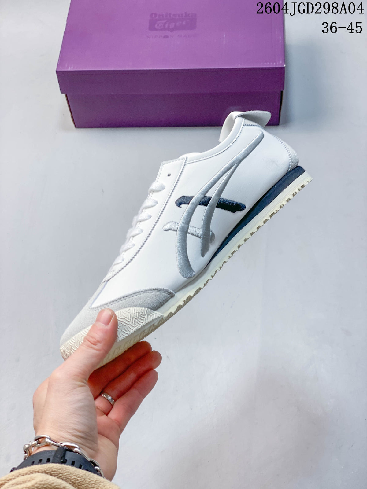Side profile of a white sneaker with silver stripes, gray toe detailing, and a cream outsole.