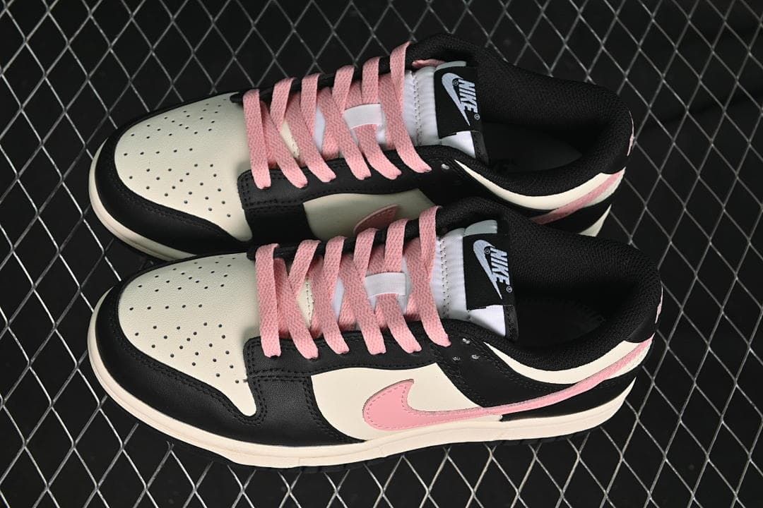 Pair of black, off-white, and pink low-top sneakers viewed from above