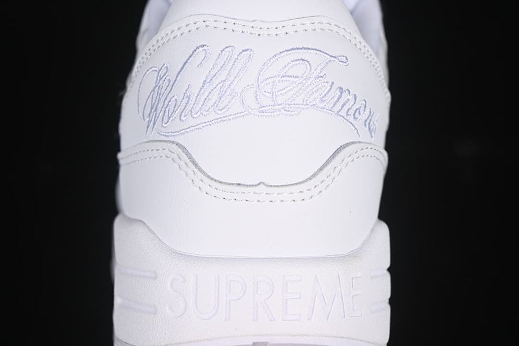 Heel detail with embroidered script and Supreme lettering on the midsole