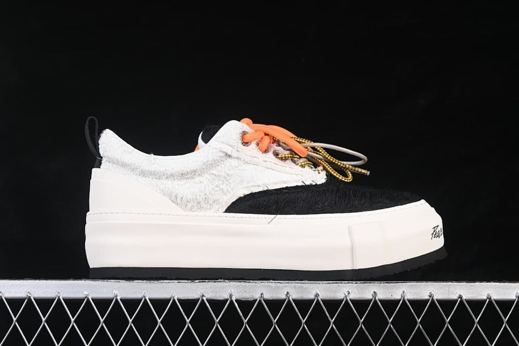 Side profile showing the thick platform sole and textured upper