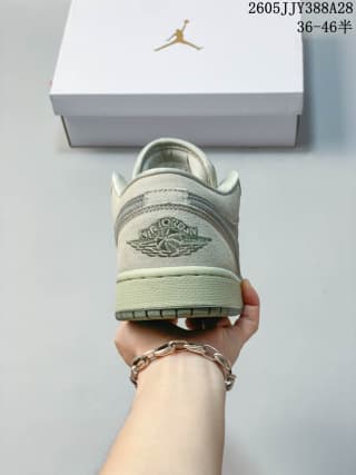 Rear view showing the embroidered Wings logo on the heel of the sneaker.