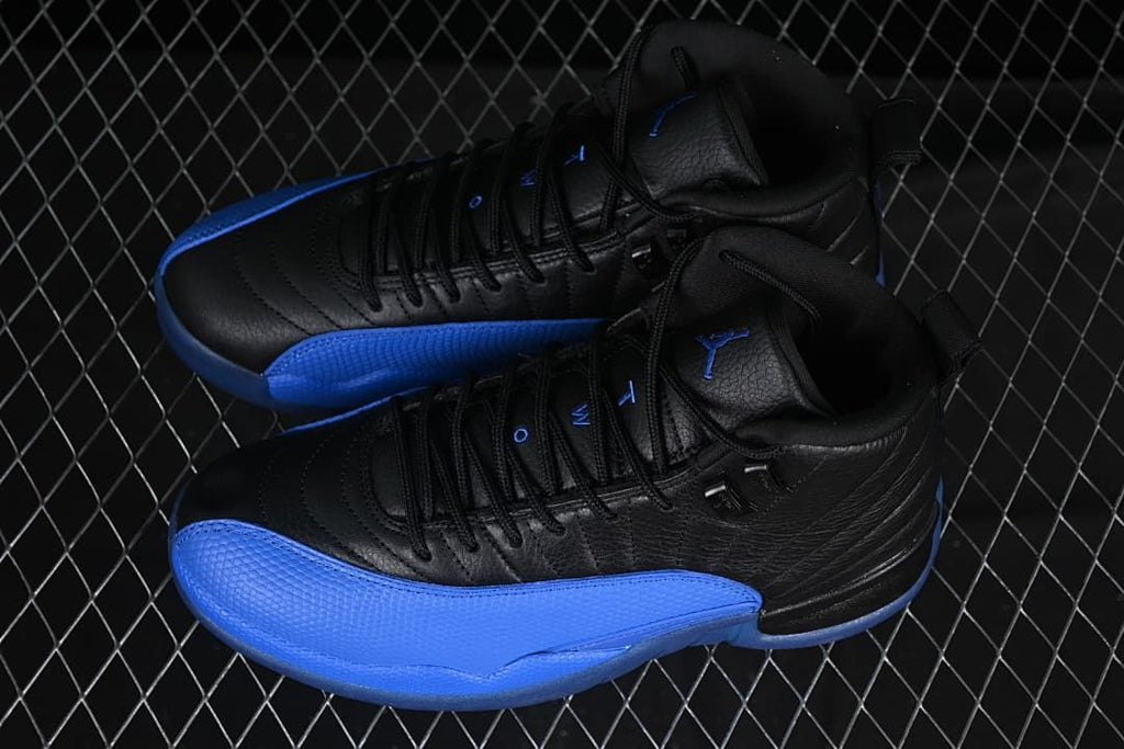 Pair of black and blue Air Jordan 12 sneakers