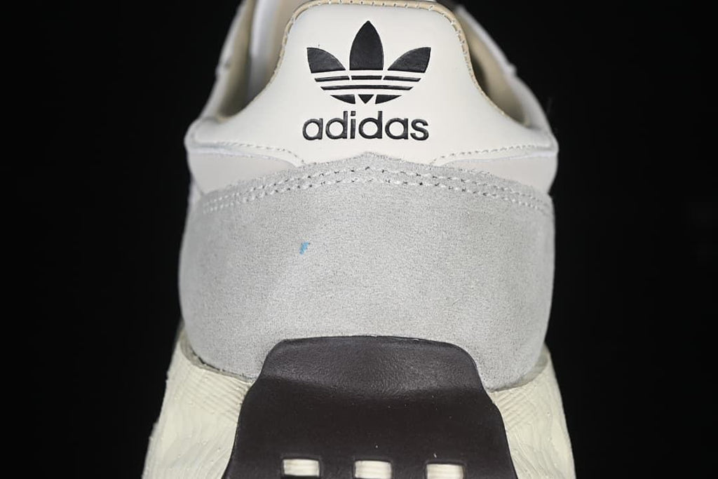 Rear view of the sneaker with adidas branding and grey heel panel