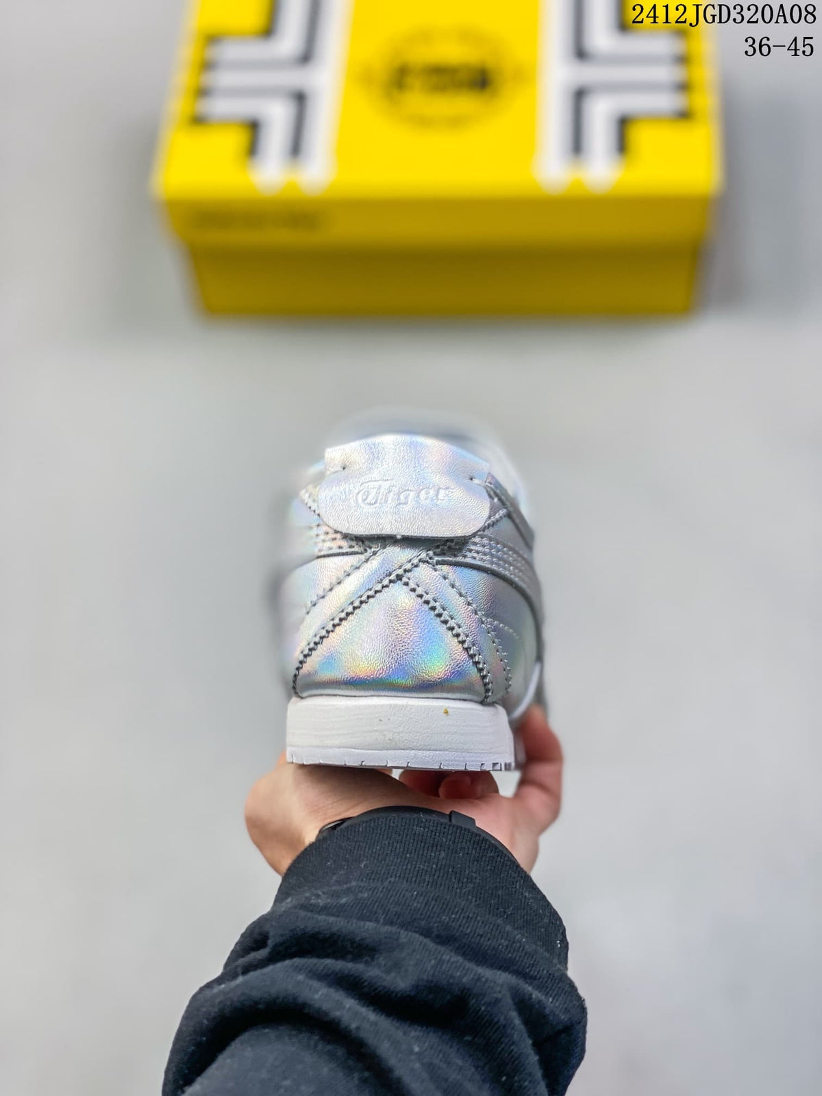 Rear view showing the stitched heel panels and white outsole of an iridescent silver sneaker