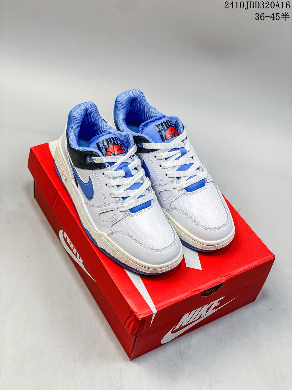Pair of white Nike Full Force Low sneakers with blue and black accents, shown on a red shoebox.