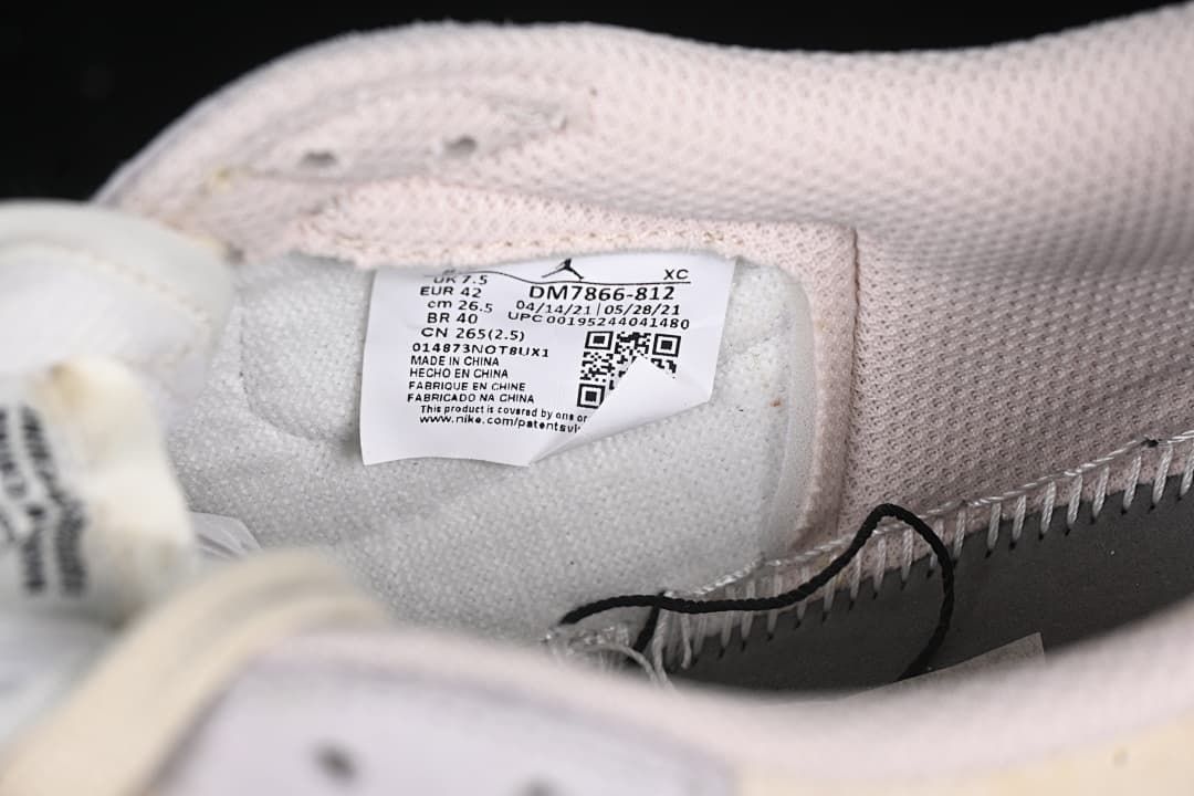Inside size label showing EU 42 and style code DM7866-812