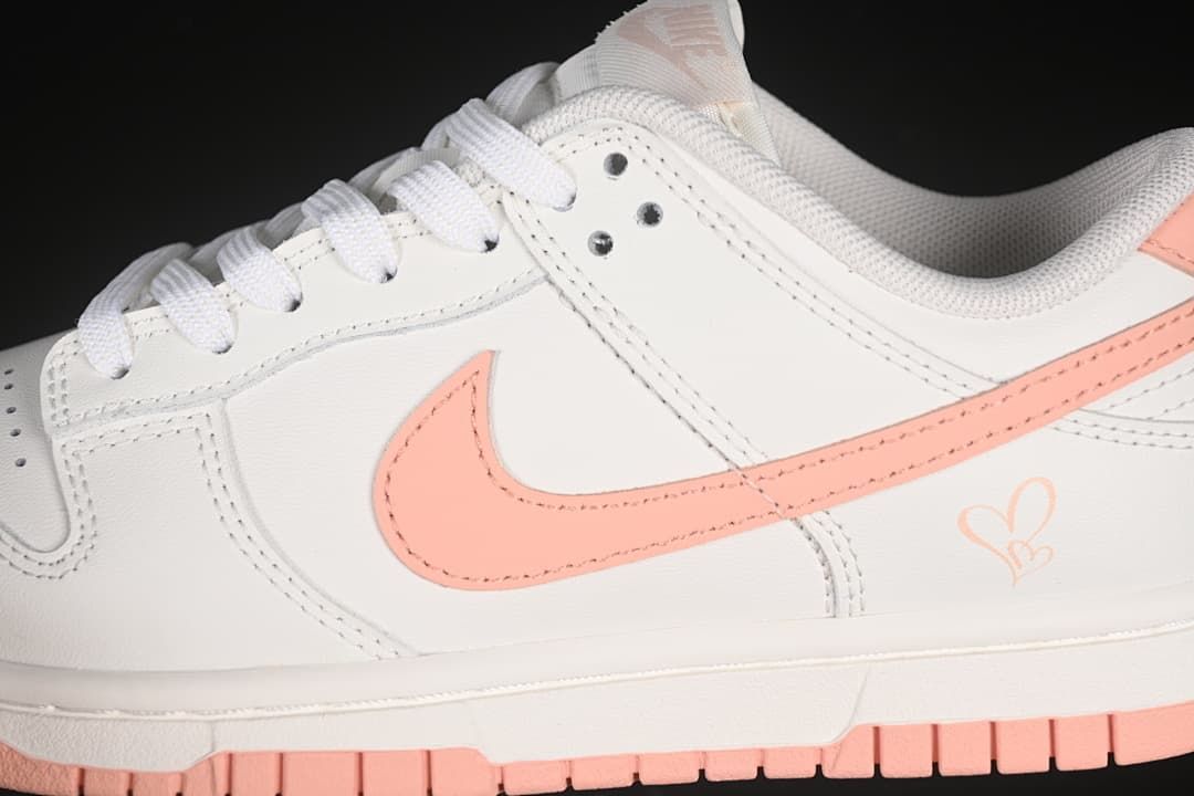 Close-up of the pink side Swoosh and off-white upper