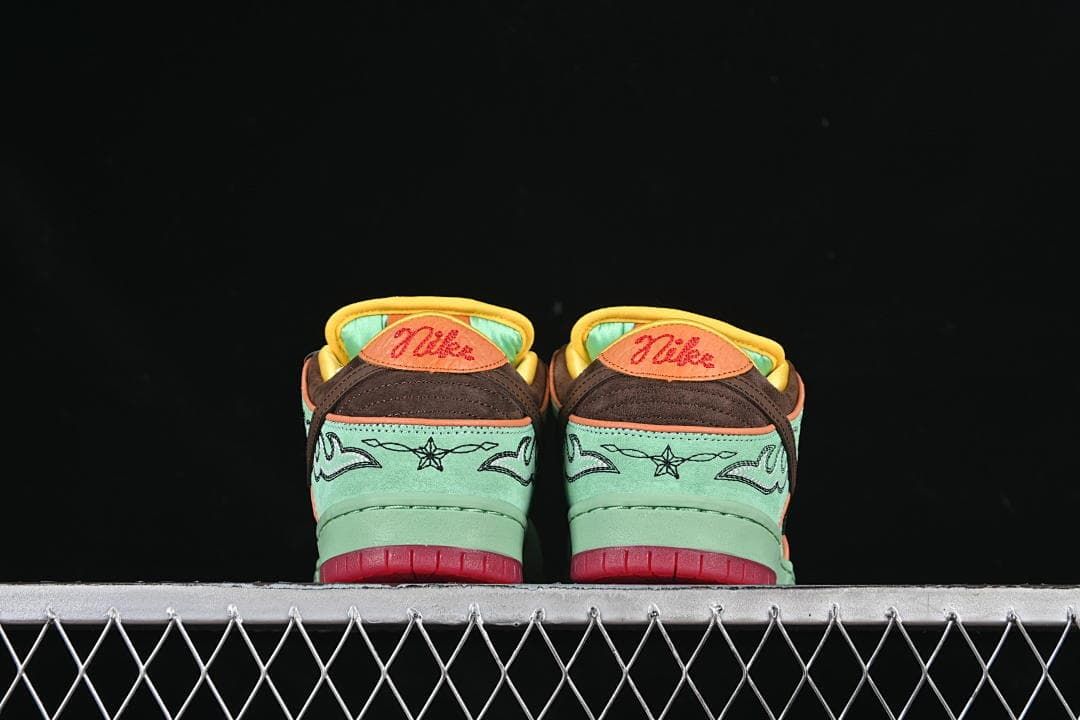 Rear view of both sneakers with embroidered heel details and red outsoles.