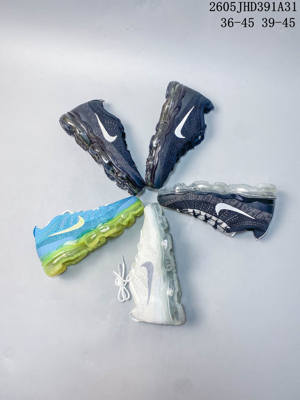 Several Nike Air VaporMax 2023 Flyknit shoes in navy, white, and bright blue; size range text appears in the image.