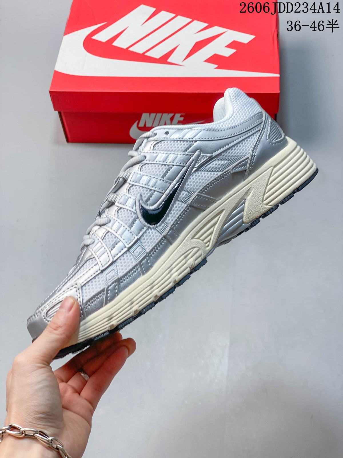 Side view of a silver and white Nike P-6000 sneaker