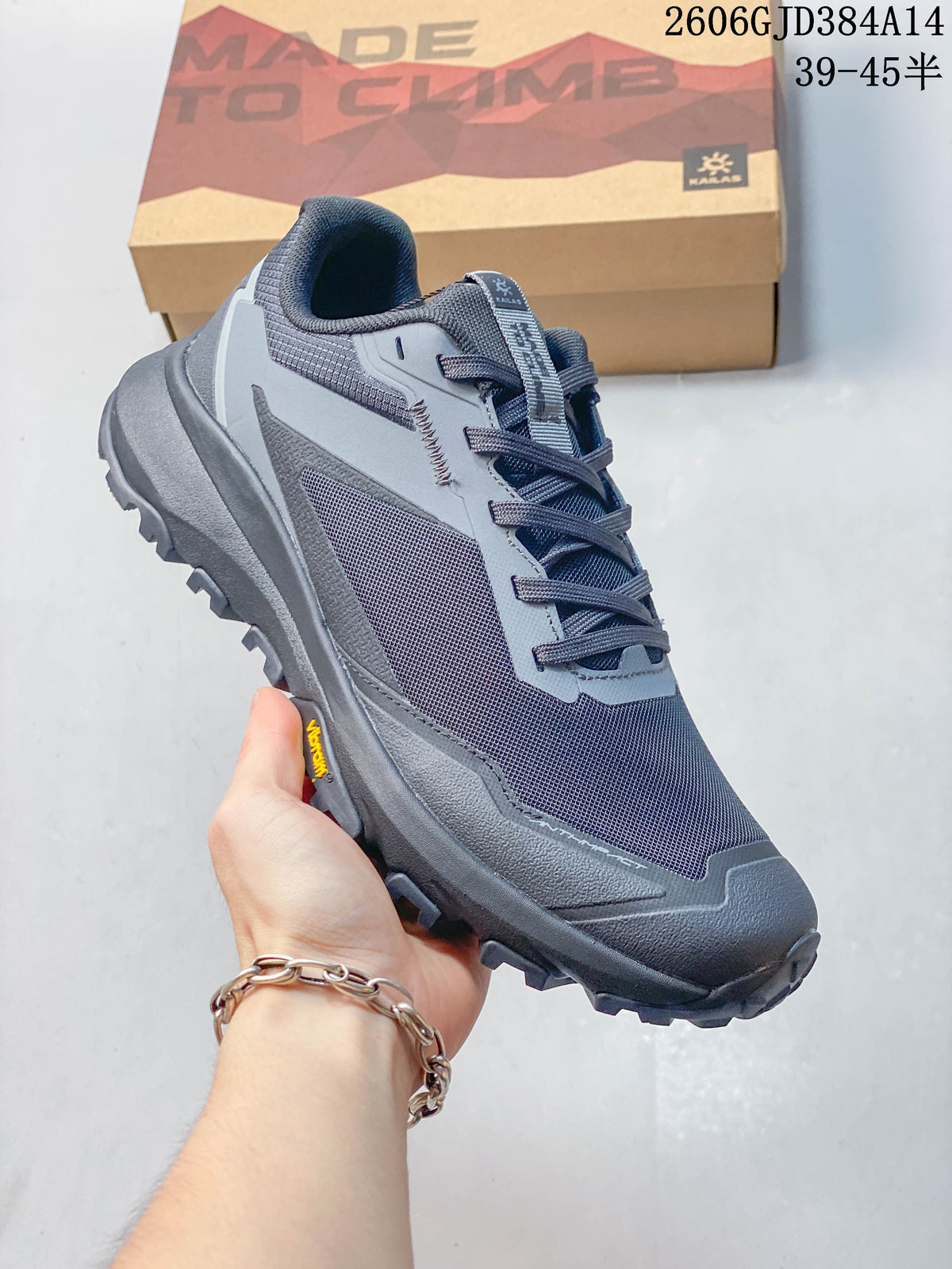 Angled view of the gray sneaker with layered side panels and lugged outsole