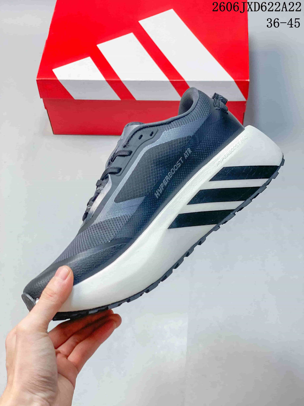 Side view of the gray sneaker with white midsole and HYPERBOOST AIR marking.