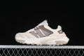 Side view of the adidas XLG Storm Edge sneaker in light neutral tones with brown accents.