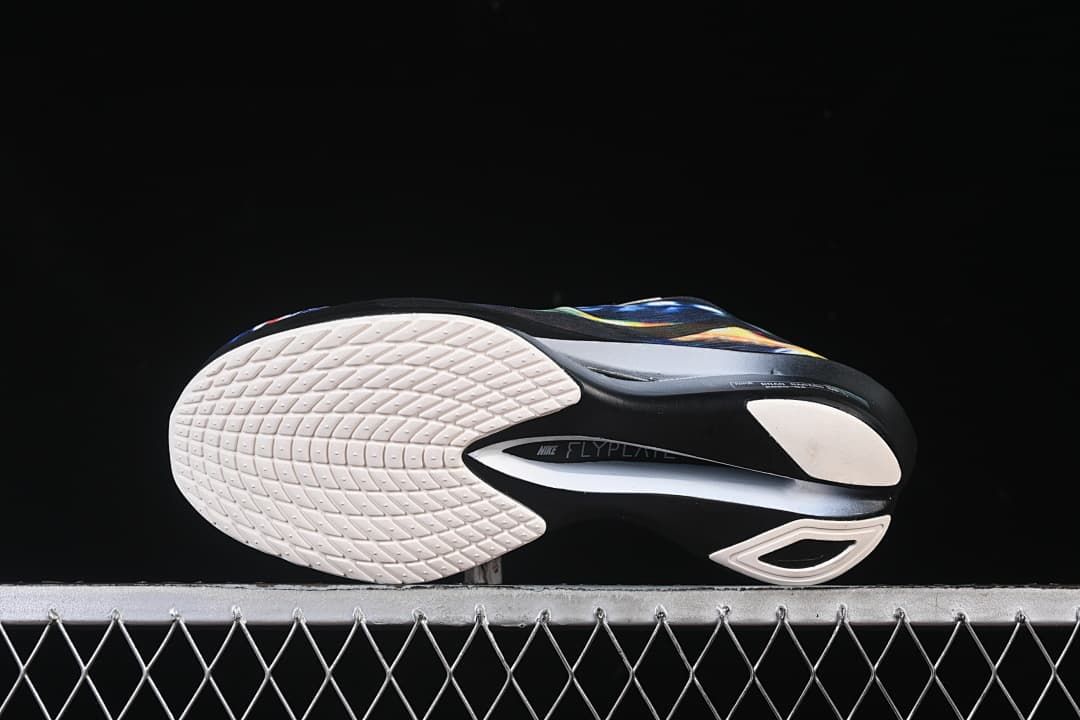 Bottom view showing white outsole sections and black midfoot area