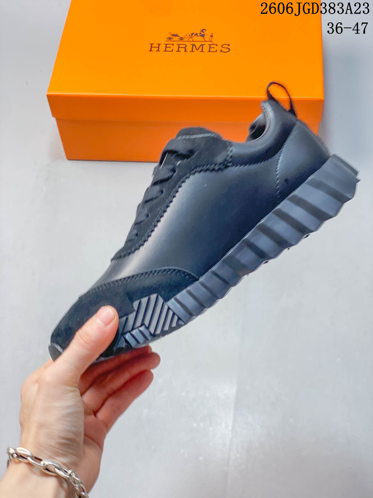 Side view of the dark navy sneaker highlighting its panel construction and ridged outsole.