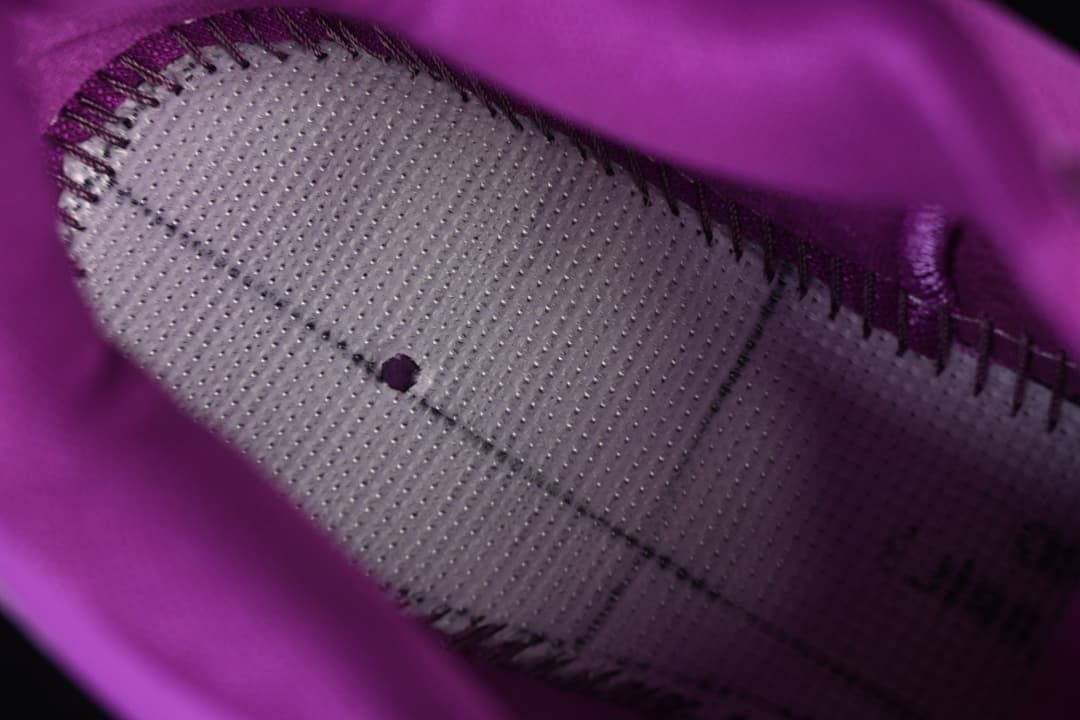 Close-up of the shoe interior and perforated footbed