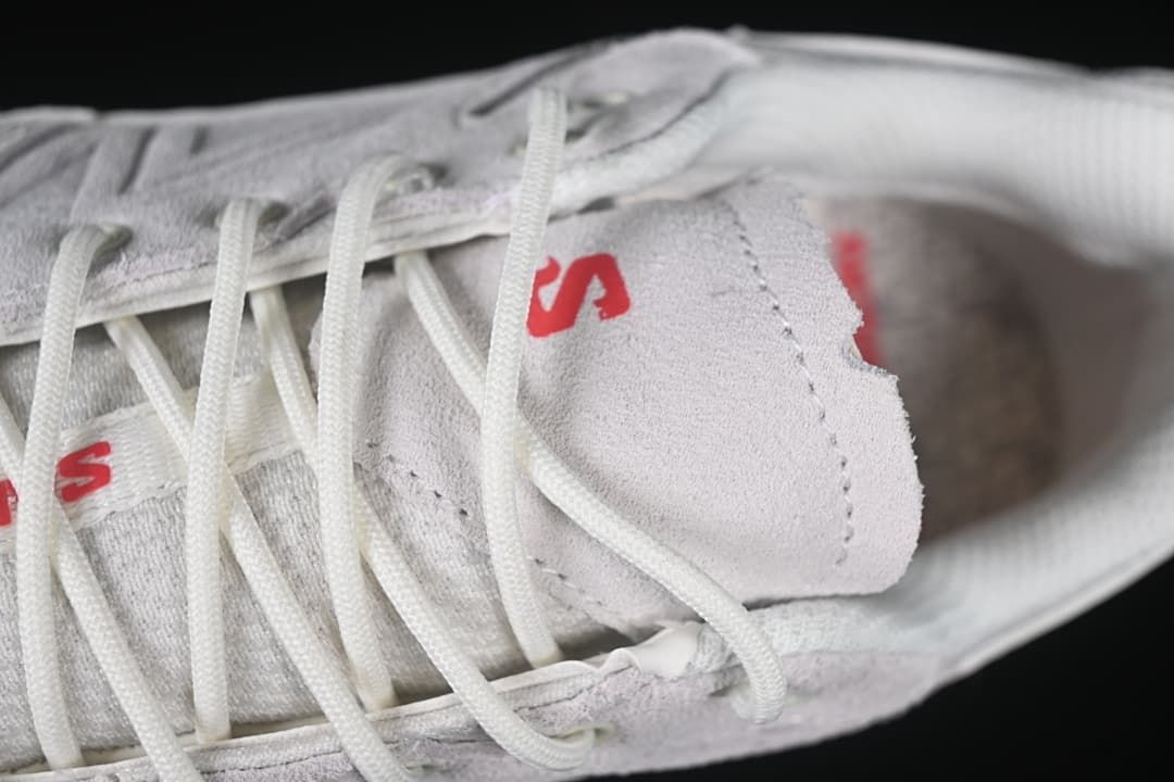 Close-up of the tongue and white laces with red branding