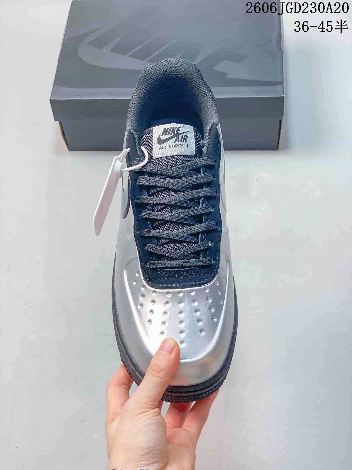 Top view of the sneaker showing its laces, perforated toe, and tongue label
