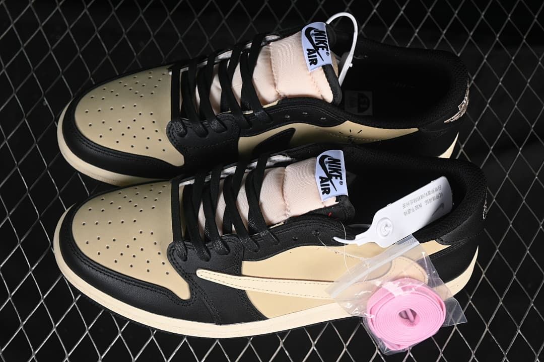 Pair of black and sail low-top sneakers with an additional pink lace set