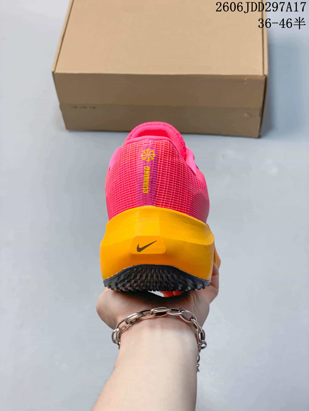 Rear view of a pink and orange Nike Zoom Fly 5 running shoe