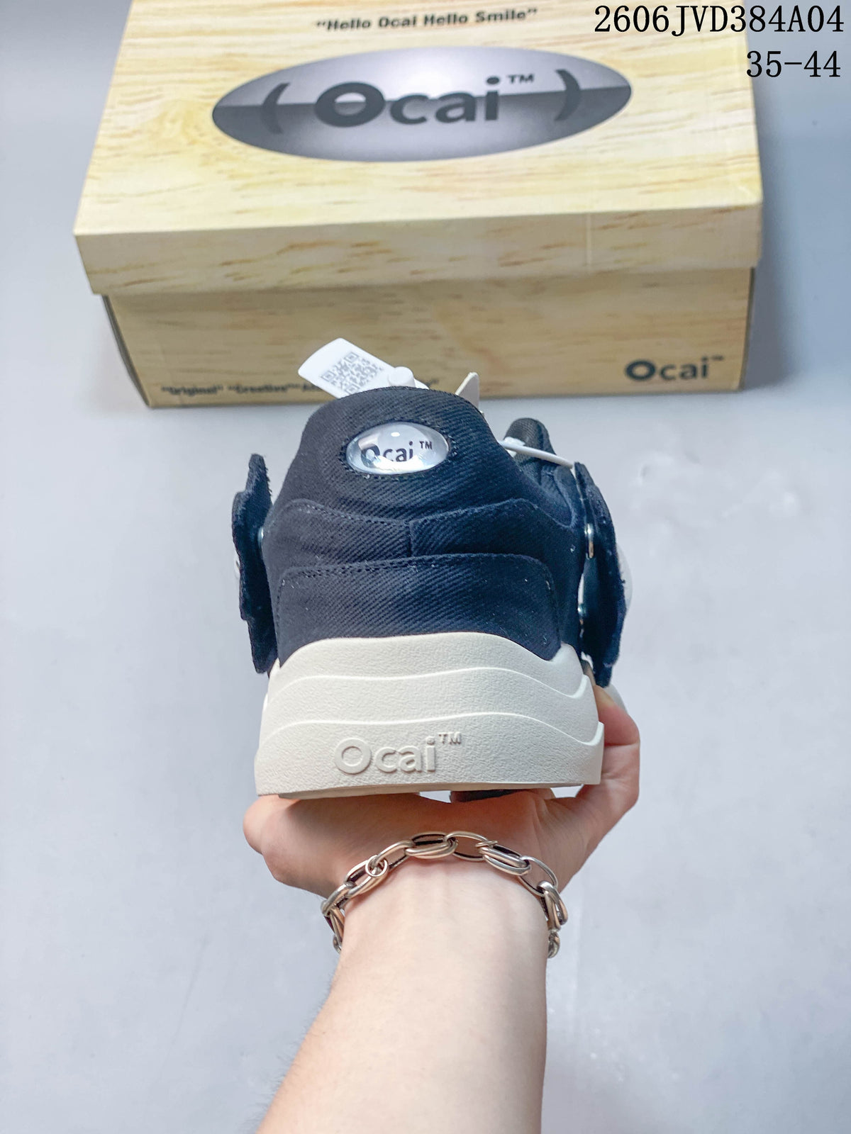 Rear view of a navy Ocai sneaker with a thick white sole