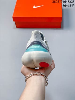 Rear view of a Nike Free RN 5.0 shoe showing teal heel accents