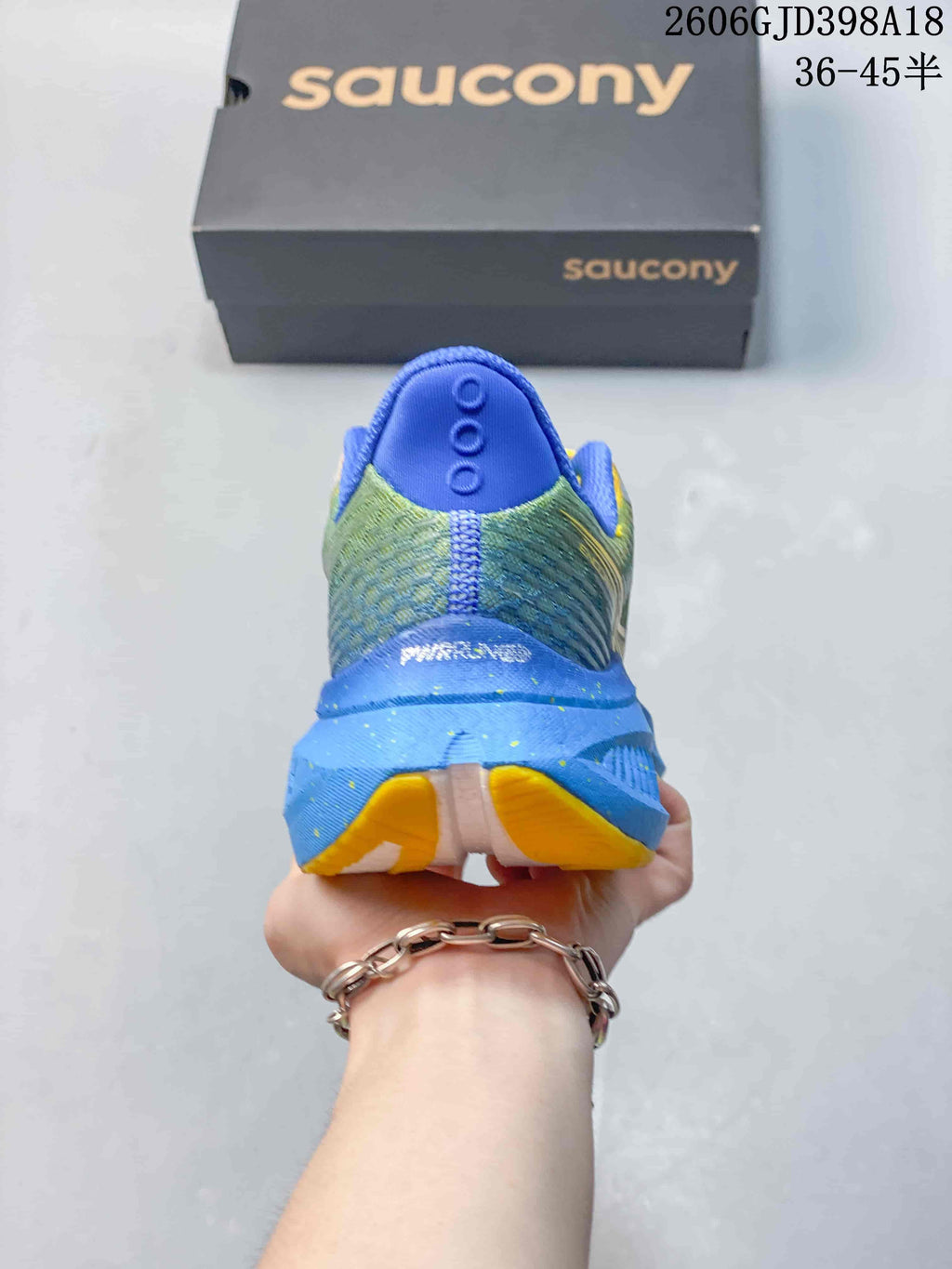 Rear view of the shoe showing the blue heel and patterned upper
