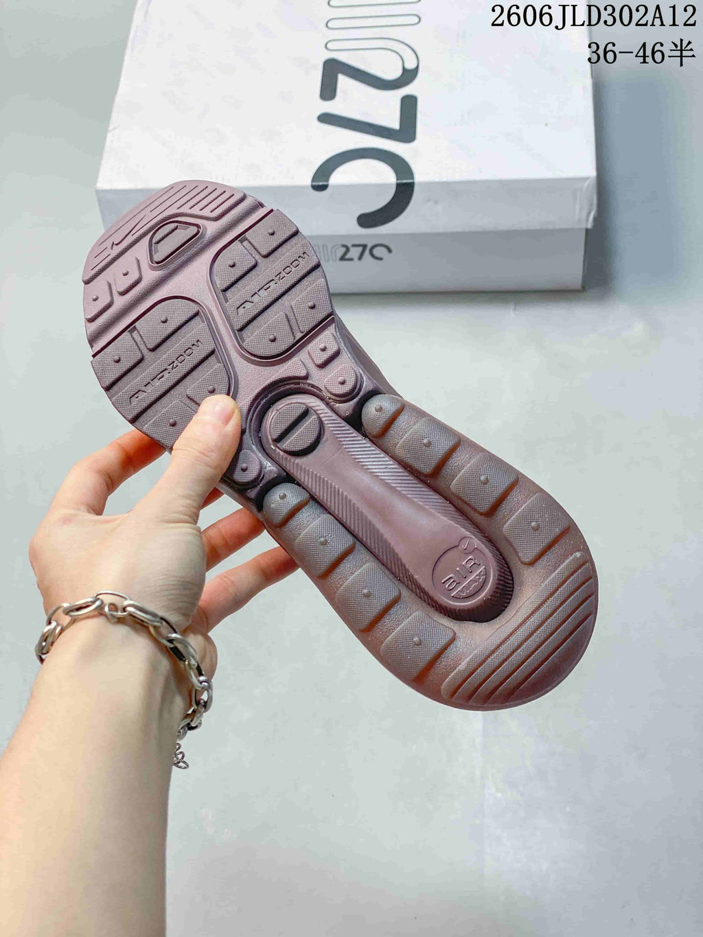 Outsole view of a mauve Nike Air Max 270 sneaker