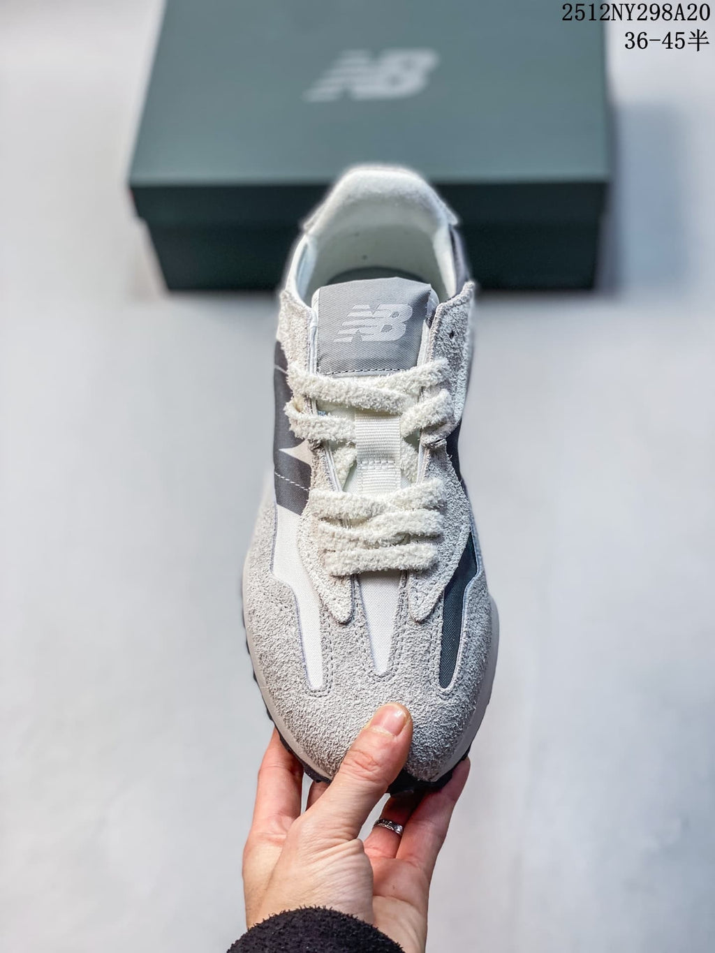 Front view of the sneaker showing its laces and layered upper
