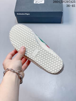Bottom view of the sneaker showing the textured light-colored outsole.