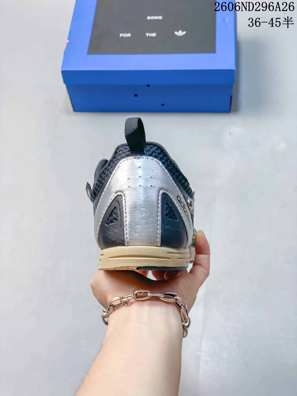 Rear view showing the silver-tone heel panel and cream-colored sole