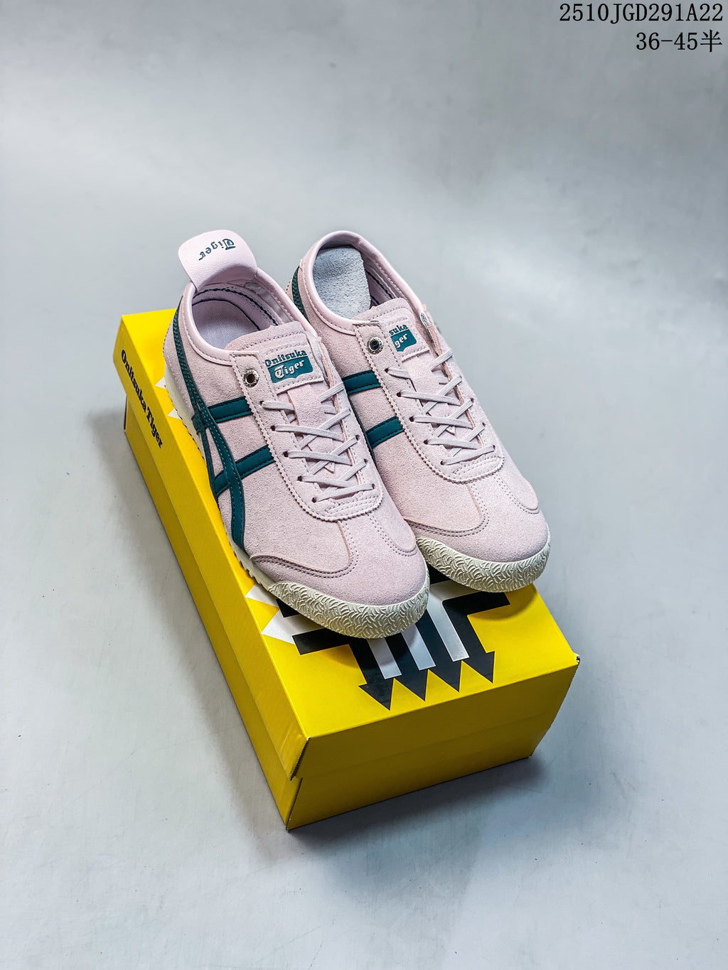 Pair of pale pink Onitsuka Tiger lace-up sneakers with teal stripes on a yellow shoe box