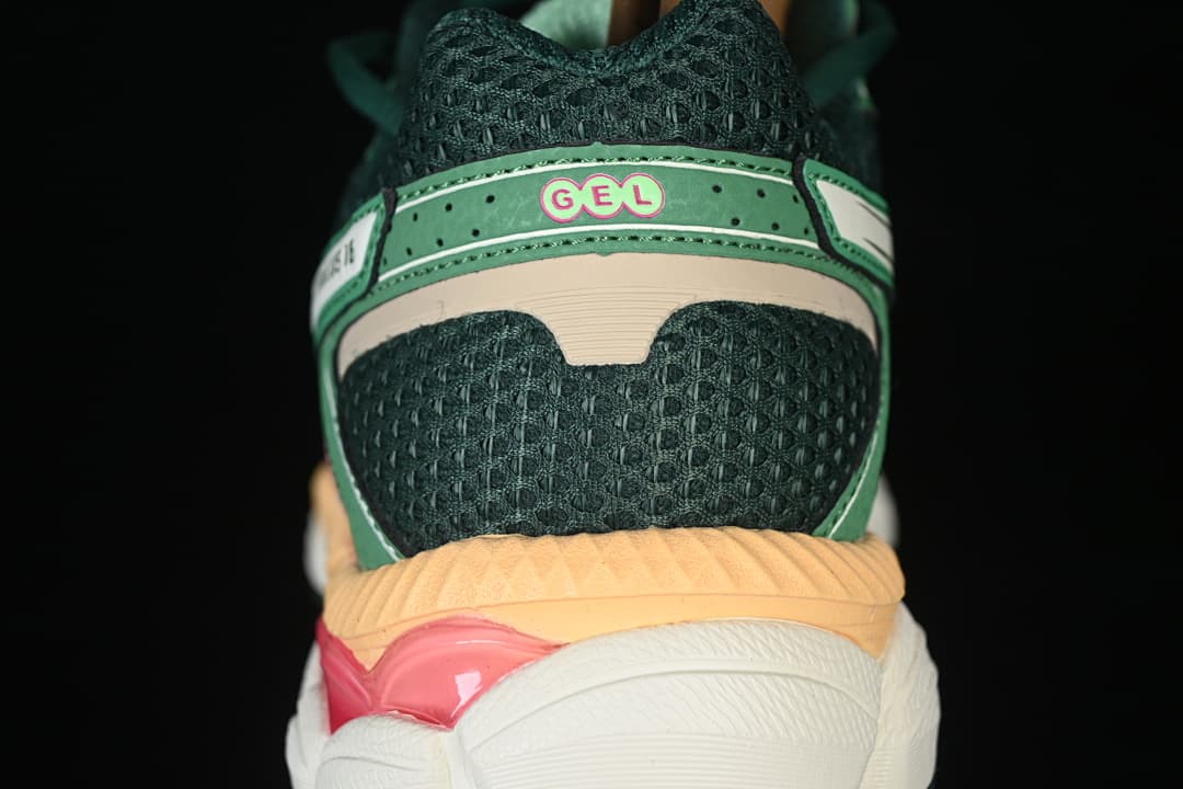 Rear view highlighting the dark green mesh heel and layered midsole
