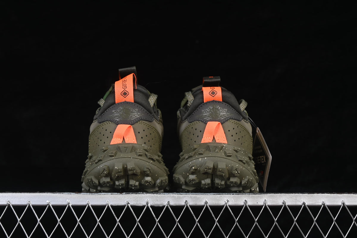Rear view showing orange heel pulls and the rugged olive outsole.
