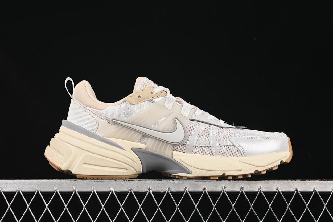 Side profile of the sneaker showing layered panels and sculpted sole