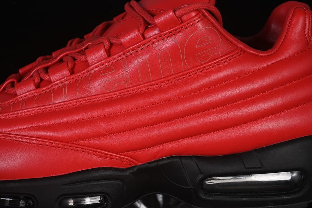 Close-up of layered red side panels and visible midsole air units