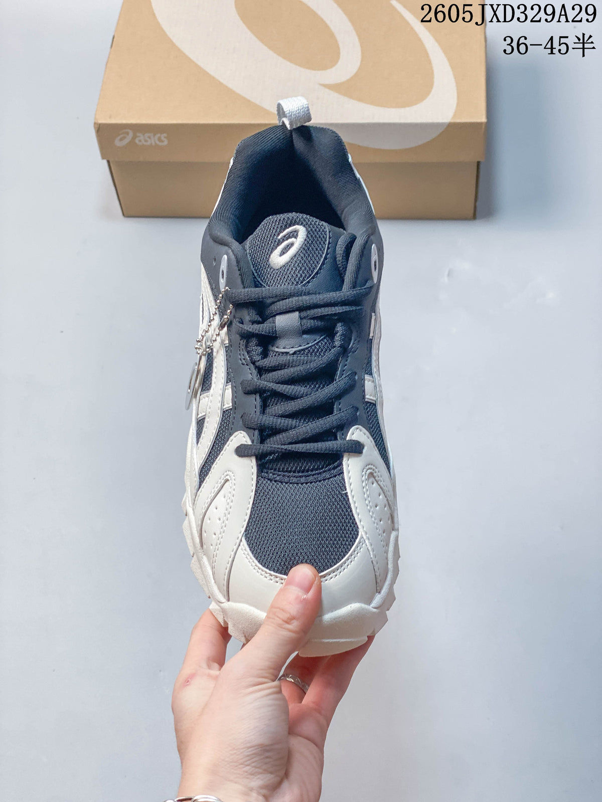 Front view highlighting the laces, tongue and perforated toe overlays.