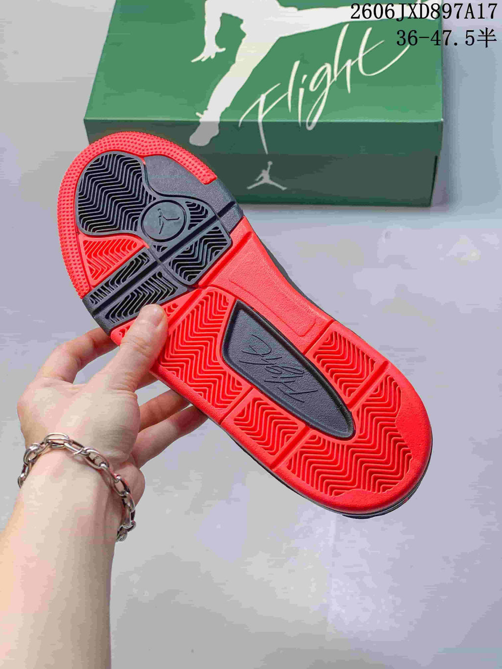 Close-up of the red and dark patterned outsole of a Jordan Flight Court shoe