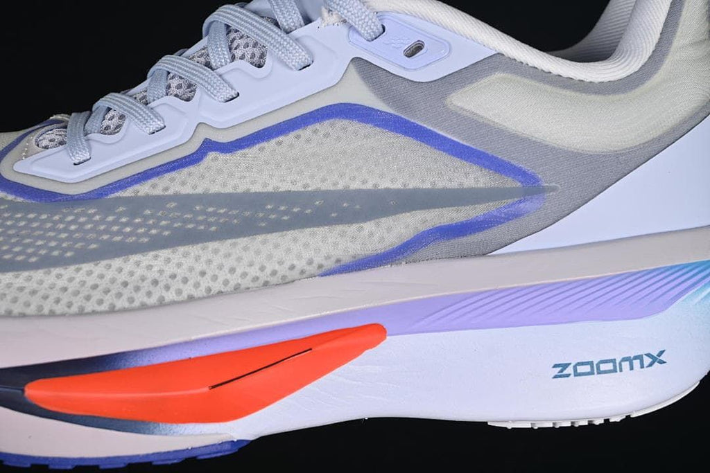 Close-up of the side swoosh, lacing area, and midsole accents.